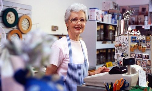 BX89X6 Senior Woman Working Cash Register