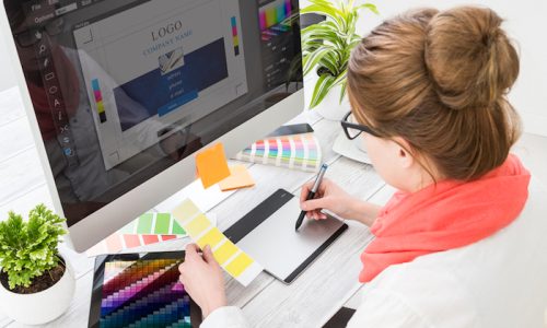 Graphic designer at work. Color swatch samples.