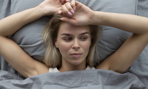 close-up-sad-woman-bed