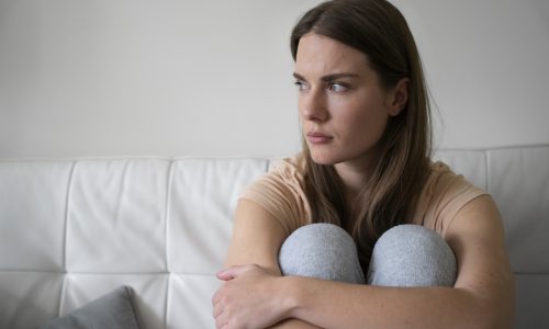 front-view-anxious-woman-couch