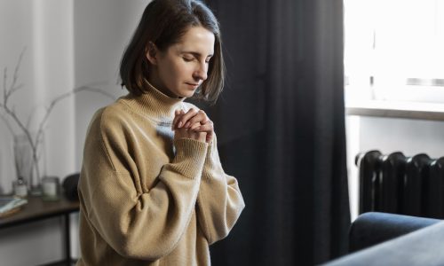 medium-shot-woman-praying-home