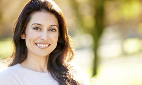 Portrait Of Attractive Hispanic Woman In Countryside