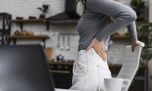 side-view-woman-having-backache-while-working-from-home
